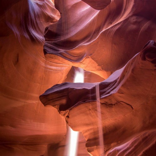 Antelope canyon lit by sunbeams